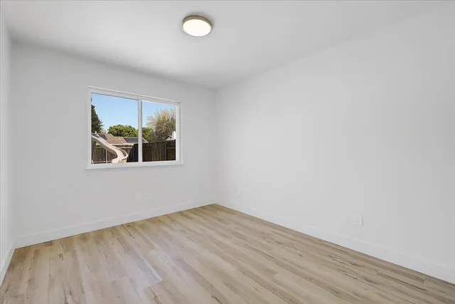 a kitchen with stainless steel appliances granite countertop a sink and a stove