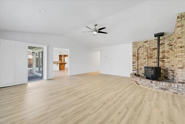 a view of empty room with floor to ceiling window