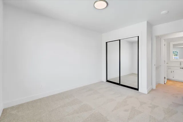 a view of a swimming pool with outdoor seating and plants