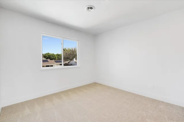 a view of a house with porch and garden