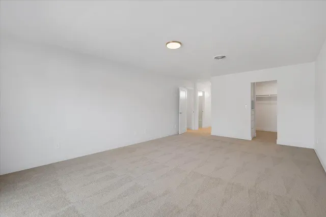 a view of a house with a back yard