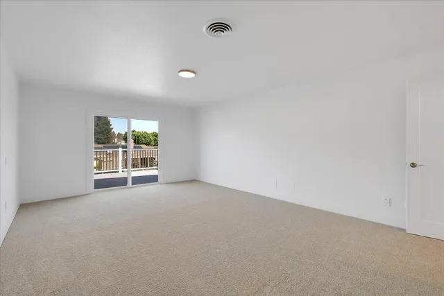 a view of a house with swimming pool and sitting area