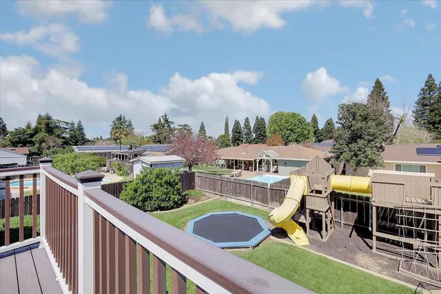 a view of a livingroom with furniture and a ceiling fan