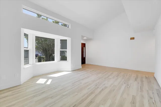 a view of a elevator with wooden floor