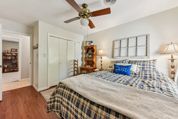 a bedroom with a bed and a dresser