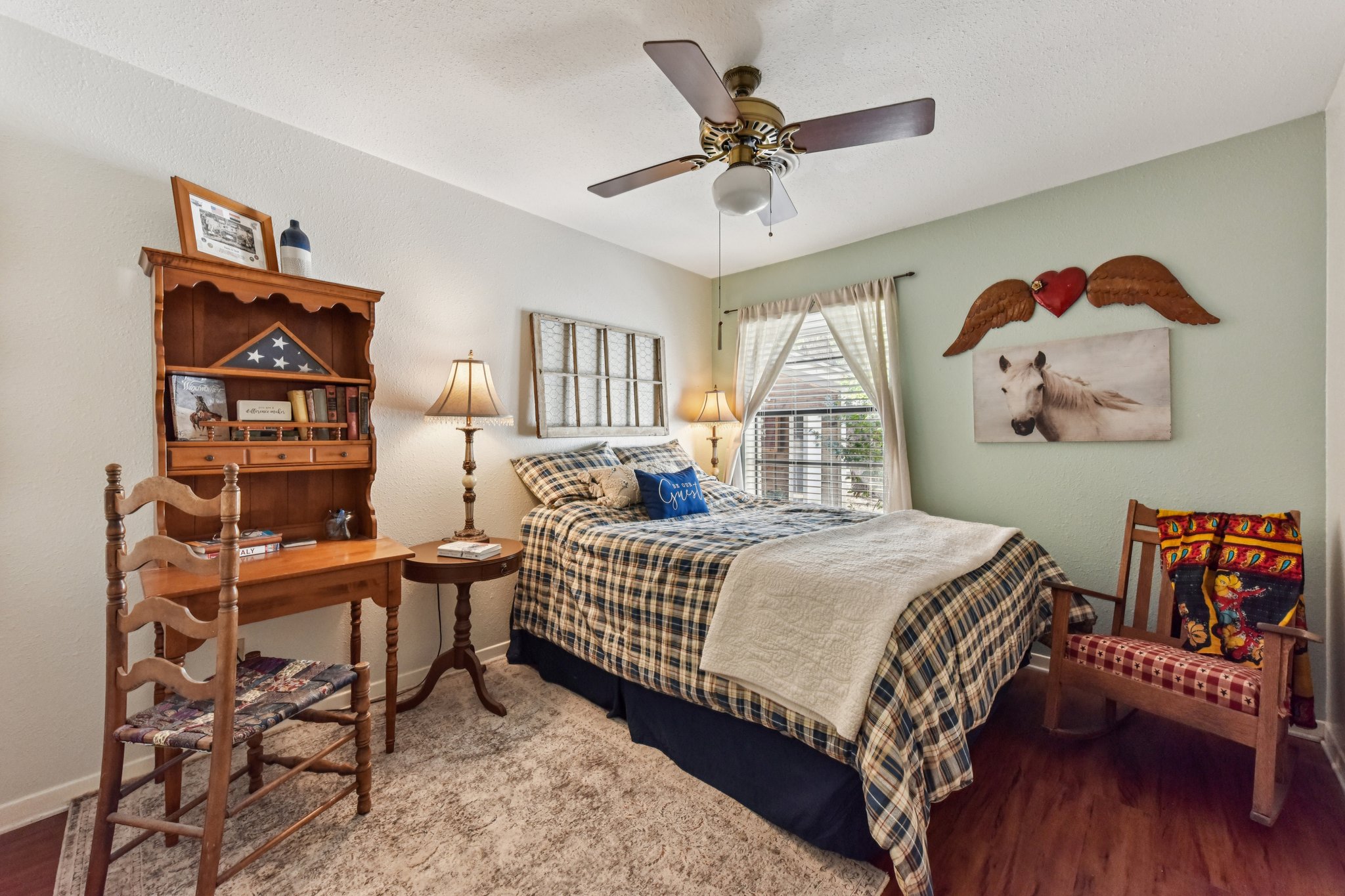 111 Post Oak Lane Elgin, TX 78621 - Photo 14 of 39 a bedroom with a bed and a chandelier