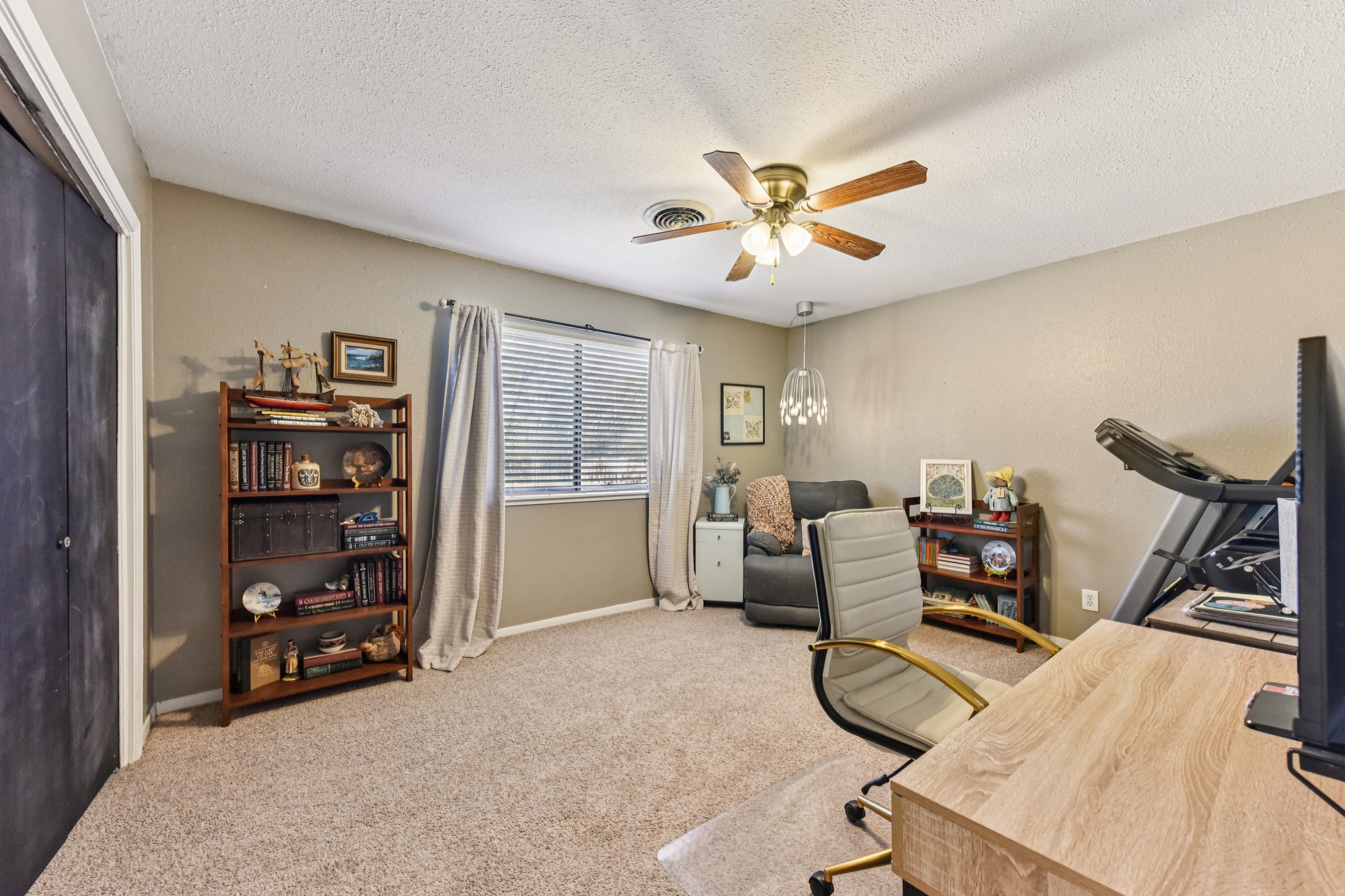 111 Post Oak Lane Elgin, TX 78621 - Photo 15 of 39 a view of a livingroom with furniture and a bookshelf