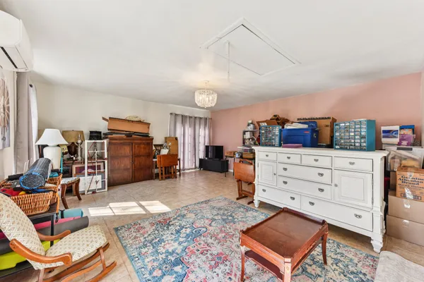 a bed room with a bed and a television