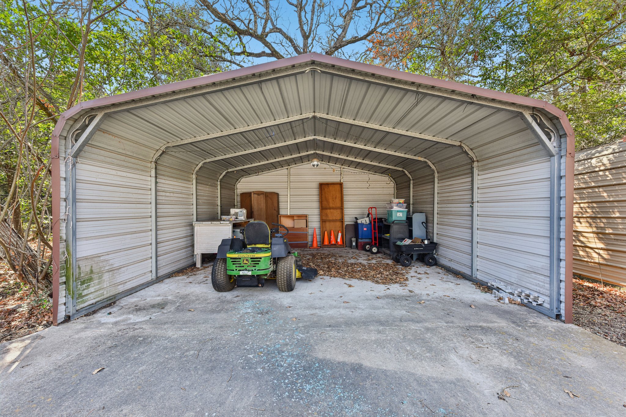 111 Post Oak Lane Elgin, TX 78621 - Photo 23 of 39 a view of a house with a small yard and a large tree