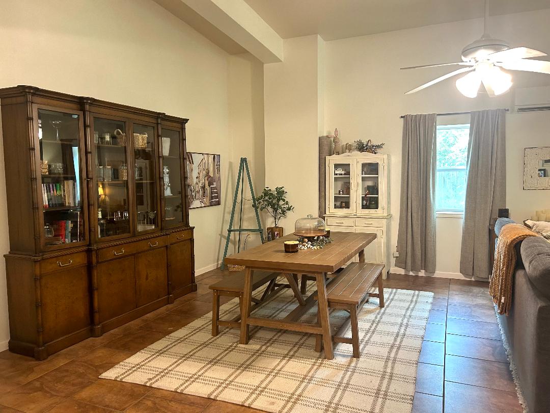 111 Post Oak Lane Elgin, TX 78621 - Photo 29 of 39 a view of a dining room with furniture and chandelier