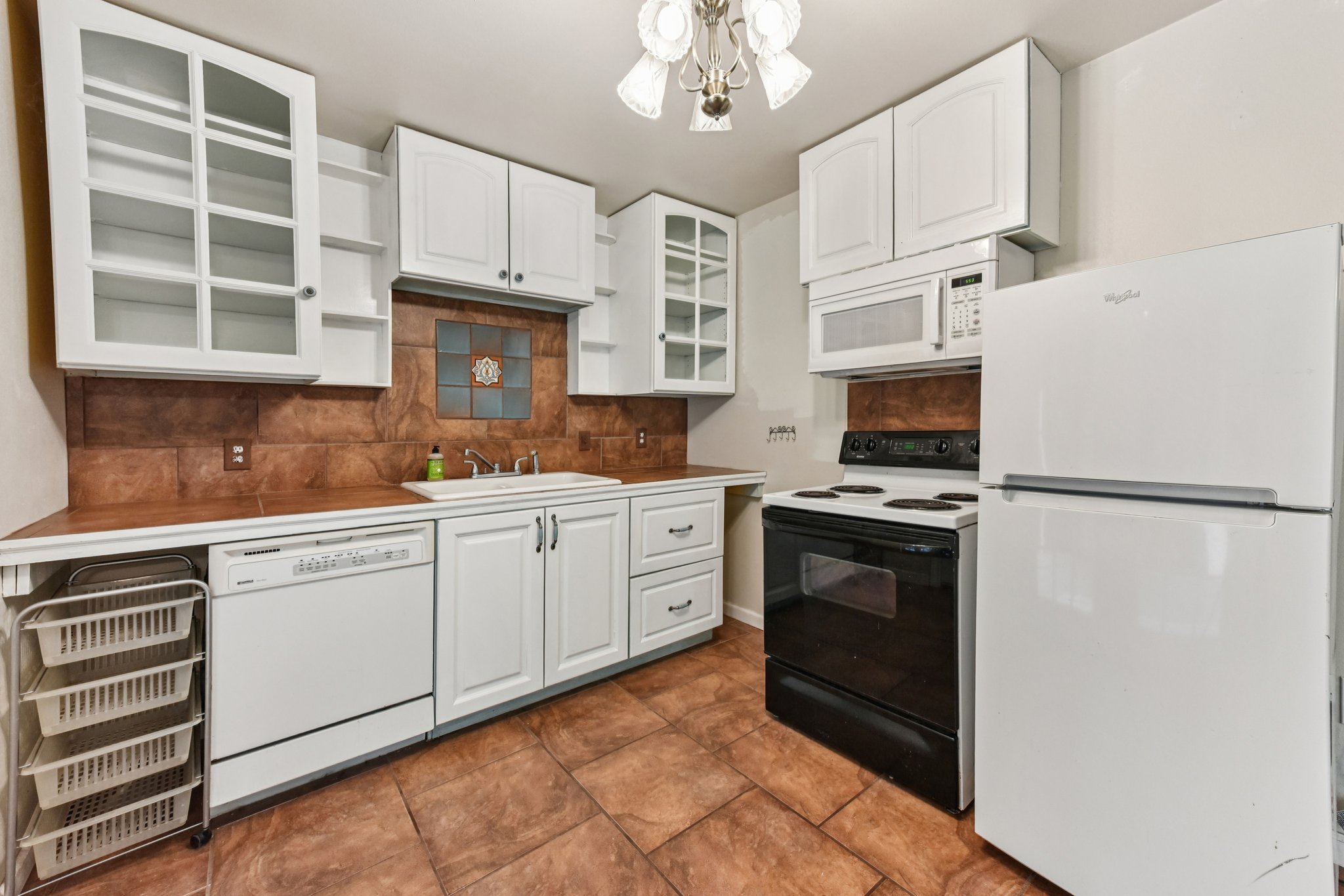 111 Post Oak Lane Elgin, TX 78621 - Photo 30 of 39 a kitchen with cabinets stainless steel appliances and a window