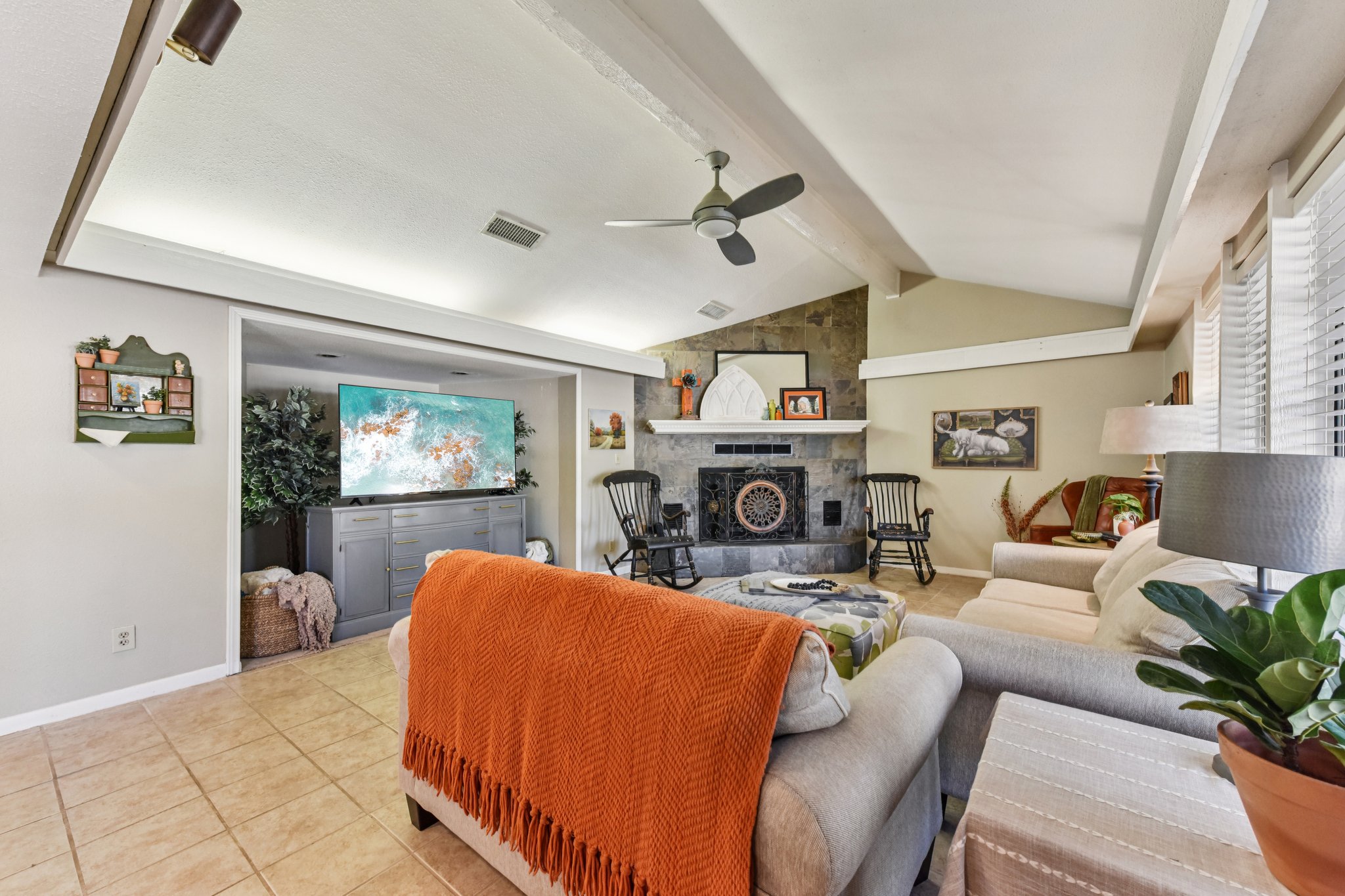 111 Post Oak Lane Elgin, TX 78621 - Photo 3 of 39 a living room with furniture a fireplace and a flat screen tv