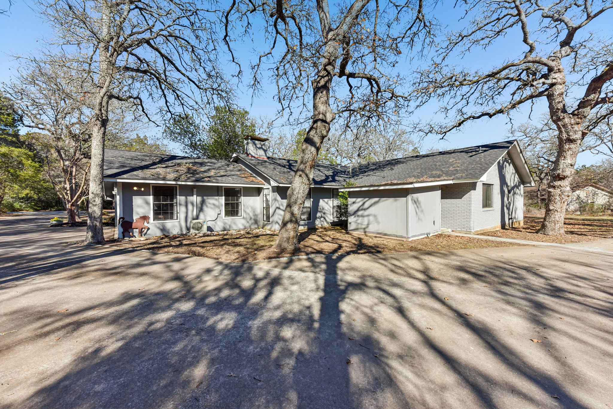 111 Post Oak Lane Elgin, TX 78621 - Photo 34 of 39 a view of a house with a patio