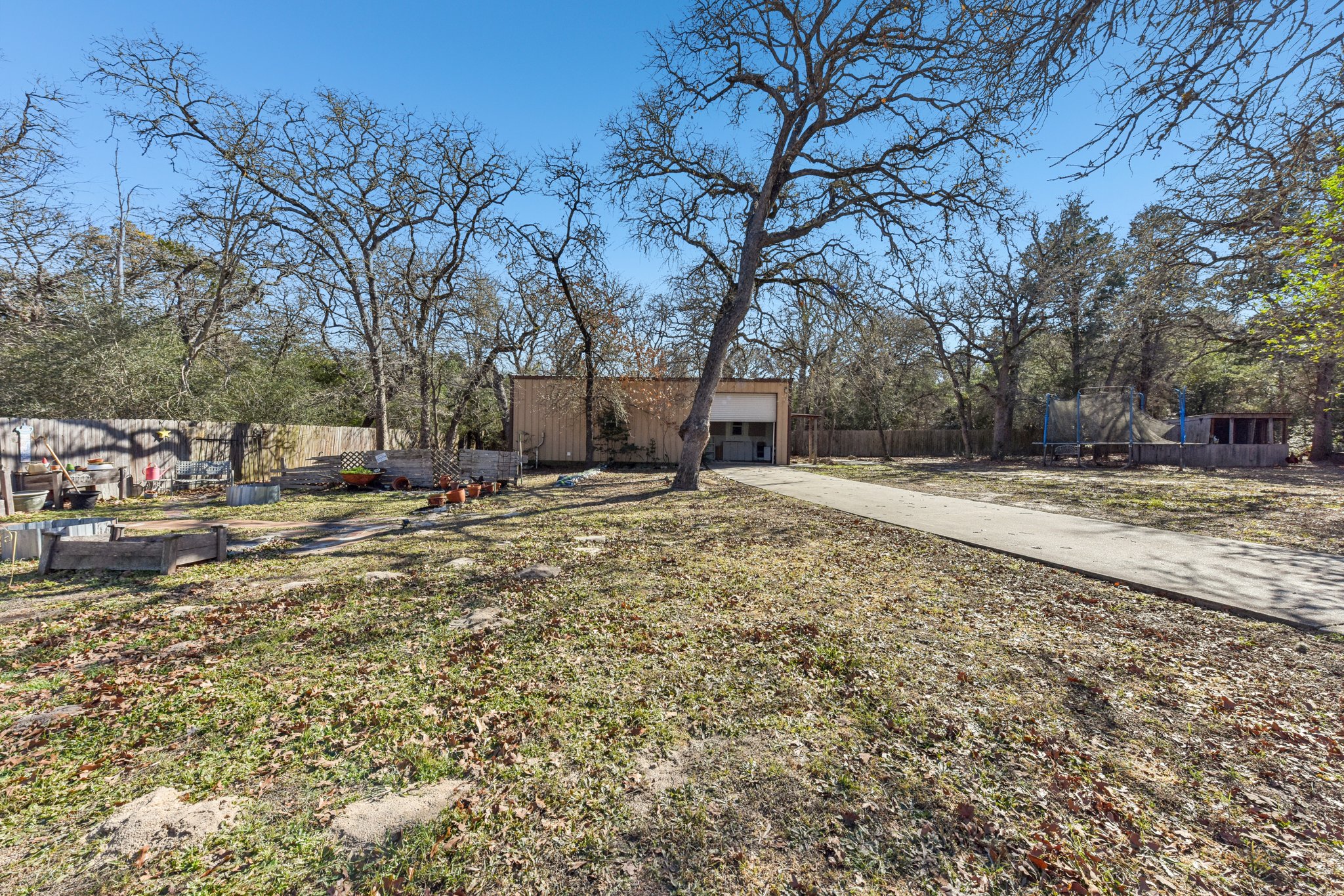 111 Post Oak Lane Elgin, TX 78621 - Photo 36 of 39 a view of a yard with a house
