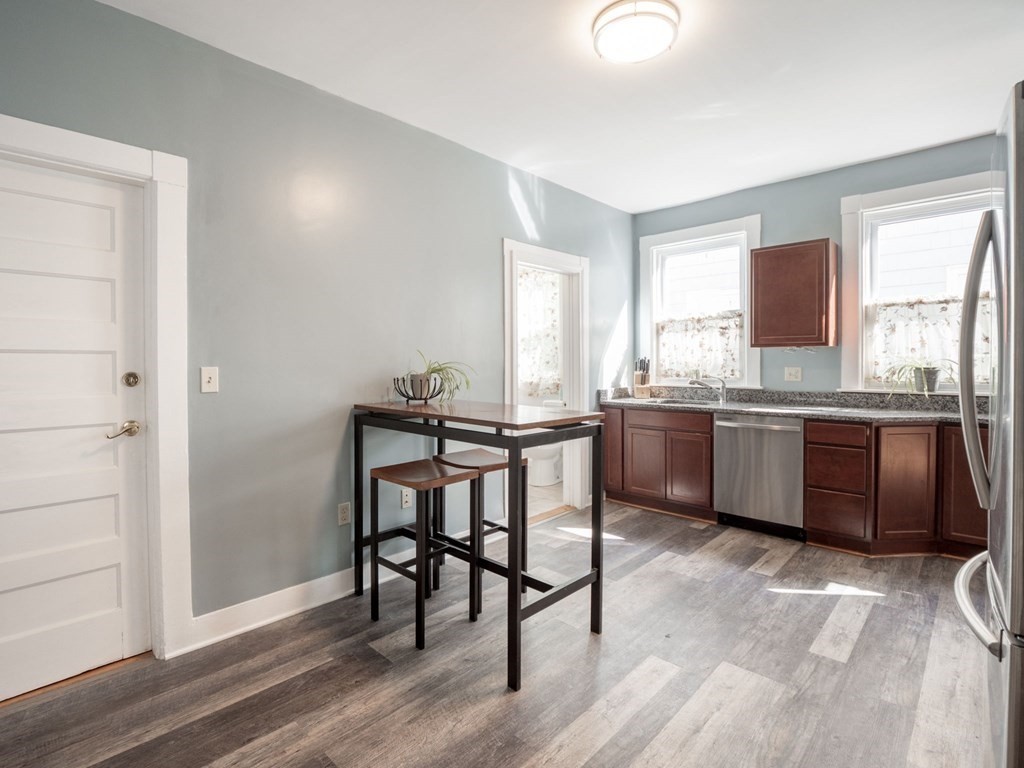 38 Cherry Street, Unit 2 Lynn, MA 01902 - Photo 12 of 40 a kitchen with a sink cabinets and wooden floor