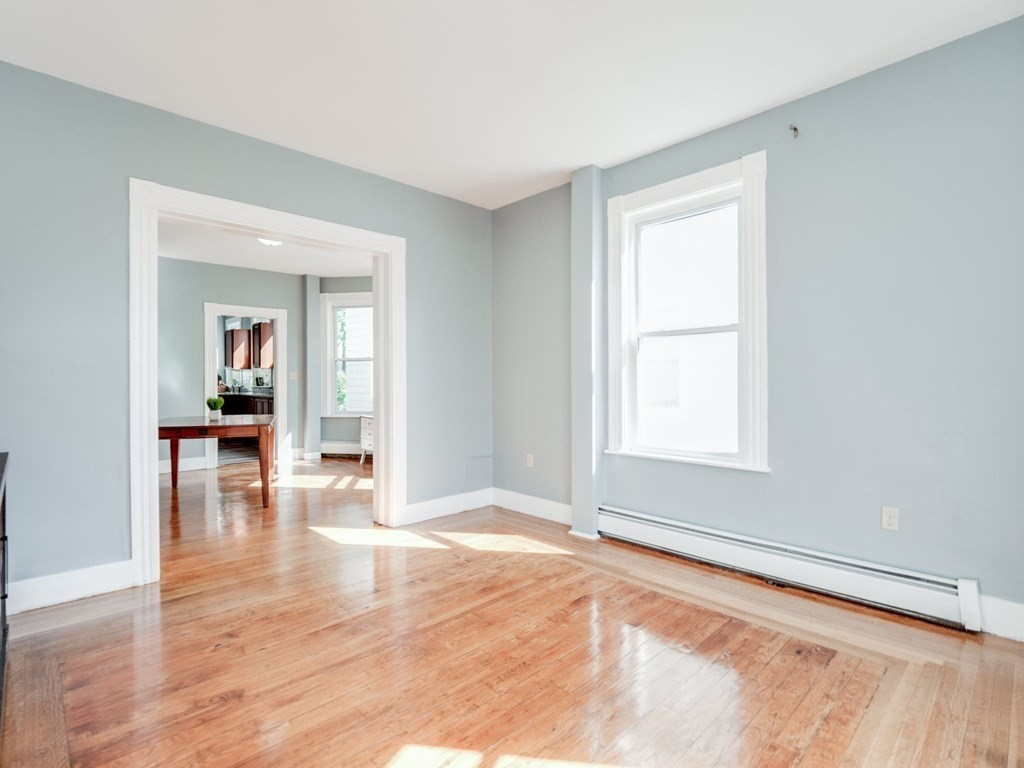 38 Cherry Street, Unit 2 Lynn, MA 01902 - Photo 13 of 40 wooden floor in an empty room with a window