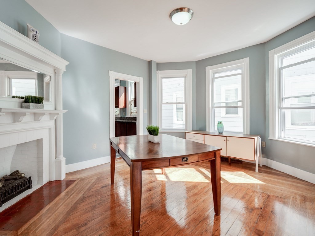 38 Cherry Street, Unit 2 Lynn, MA 01902 - Photo 16 of 40 a living room with furniture and a fireplace