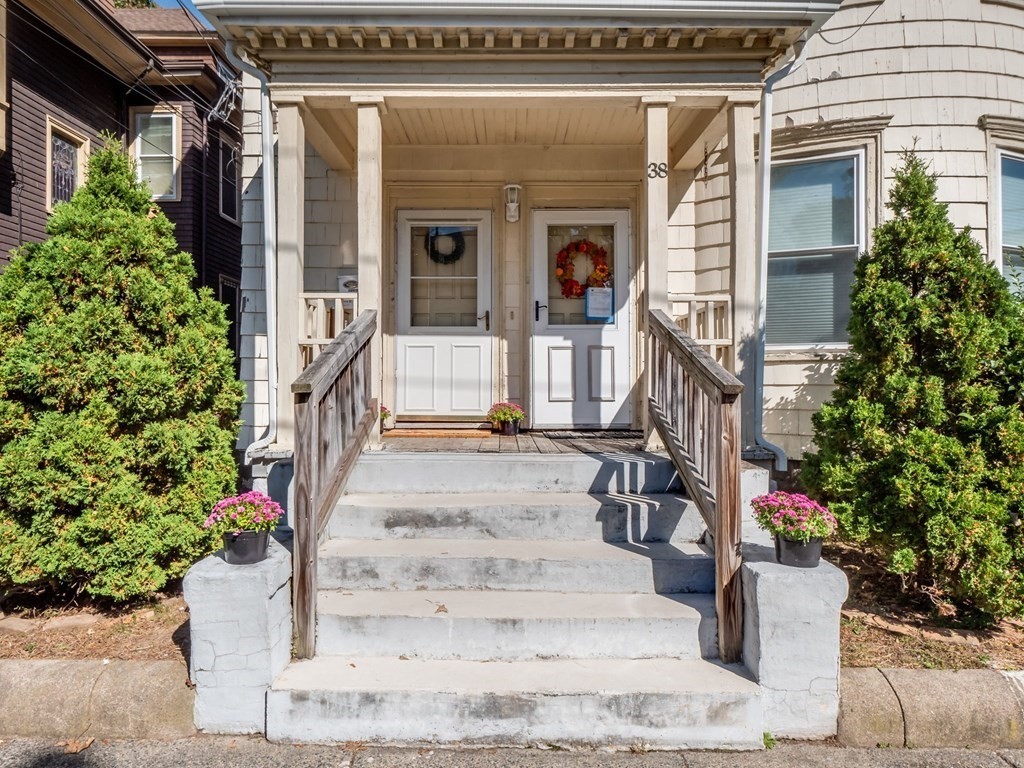 38 Cherry Street, Unit 2 Lynn, MA 01902 - Photo 2 of 40 a view of a building with a window and potted plants