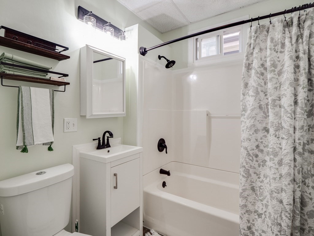 38 Cherry Street, Unit 2 Lynn, MA 01902 - Photo 21 of 40 a bathroom with a tub a sink and a toilet