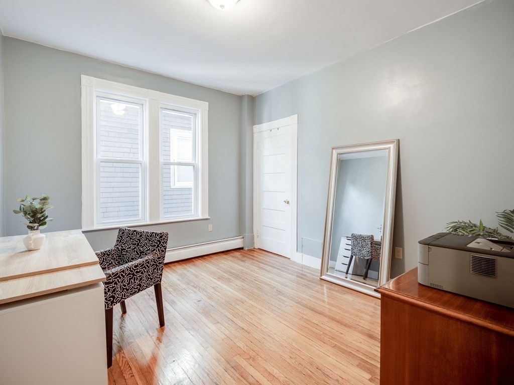 38 Cherry Street, Unit 2 Lynn, MA 01902 - Photo 22 of 40 a living room with furniture and wooden floor