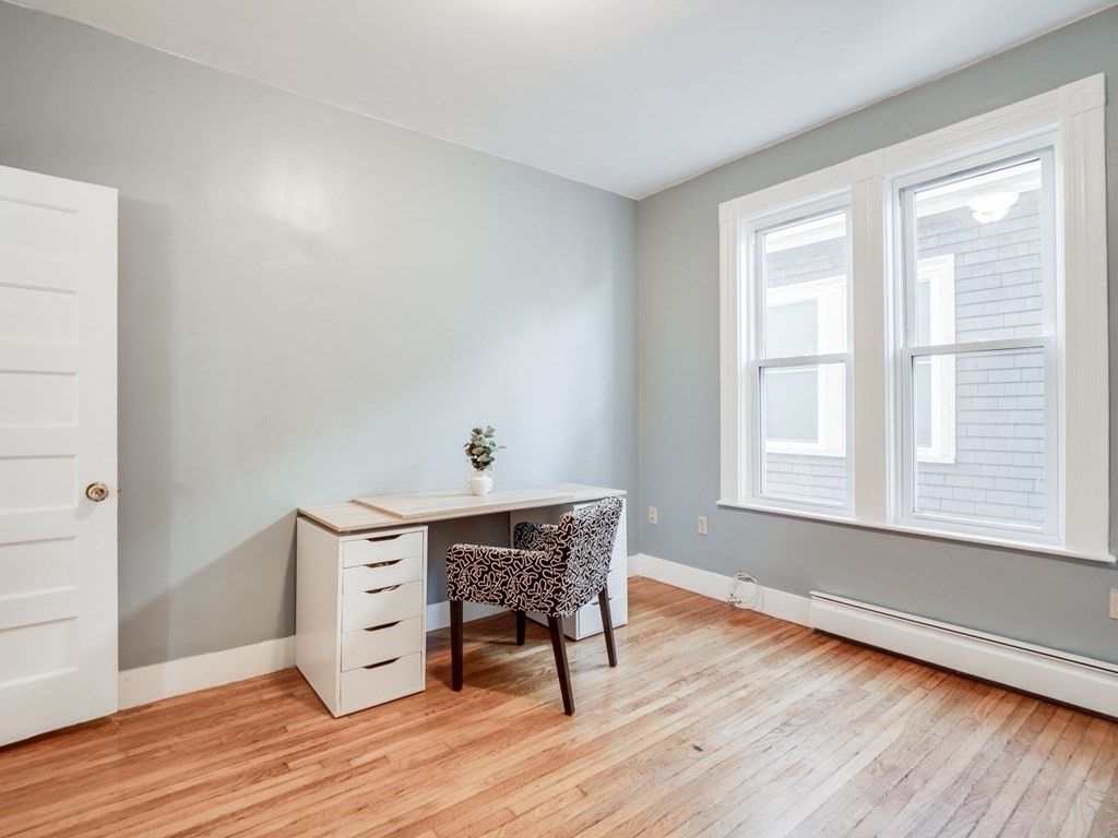 38 Cherry Street, Unit 2 Lynn, MA 01902 - Photo 23 of 40 a view of a room with wooden floor and a window