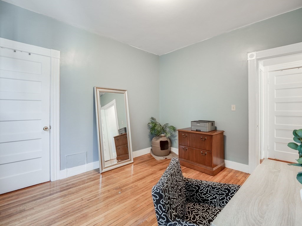 38 Cherry Street, Unit 2 Lynn, MA 01902 - Photo 25 of 40 a bed room with furniture and wooden floor