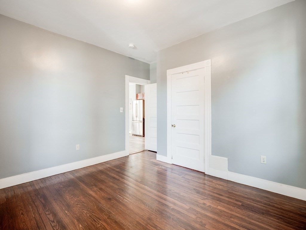 38 Cherry Street, Unit 2 Lynn, MA 01902 - Photo 28 of 40 a view of an empty room with wooden floor