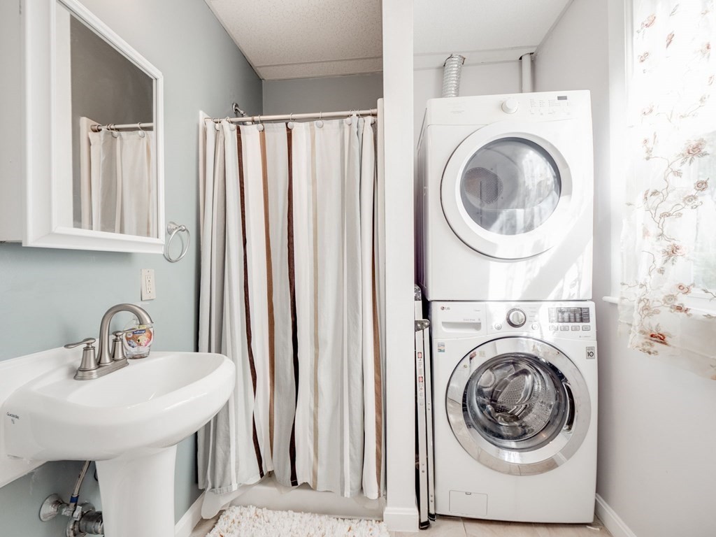 38 Cherry Street, Unit 2 Lynn, MA 01902 - Photo 32 of 40 a utility room with sink dryer and washer