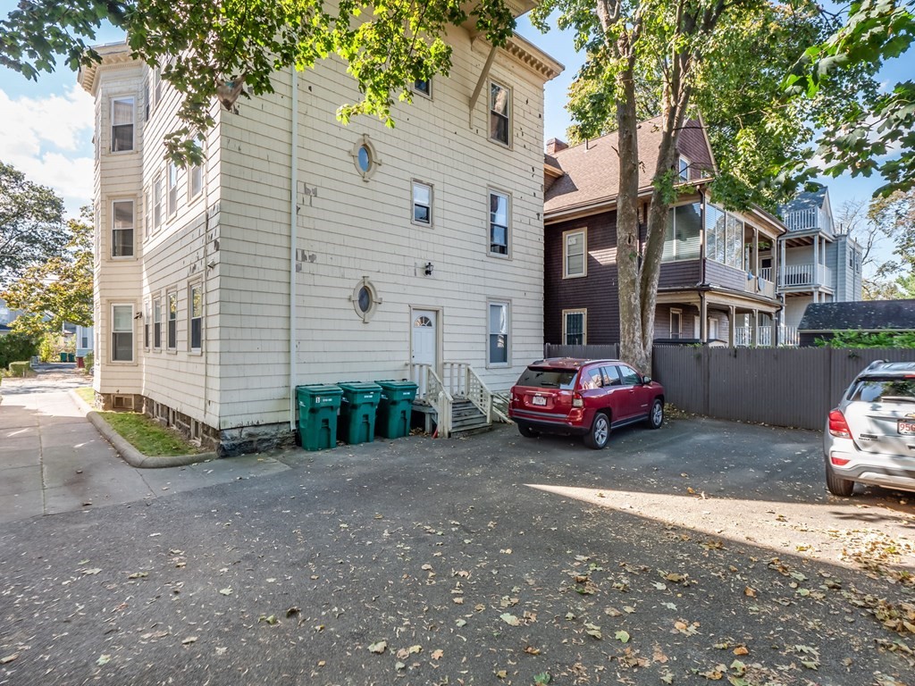 38 Cherry Street, Unit 2 Lynn, MA 01902 - Photo 39 of 40 a car parked in front of a house