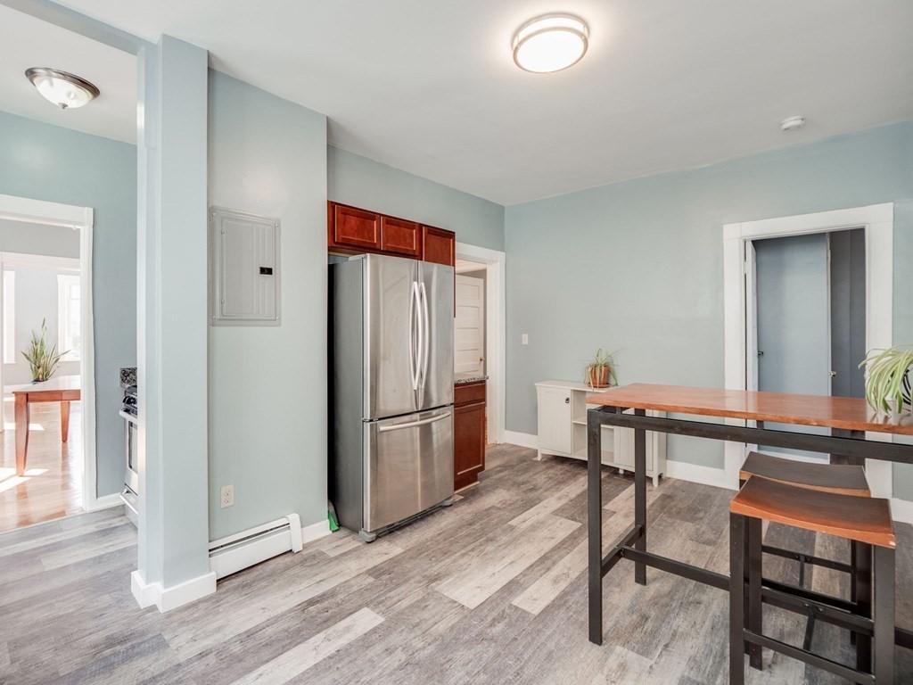 38 Cherry Street, Unit 2 Lynn, MA 01902 - Photo 6 of 40 a view of a workspace with furniture and wooden floor