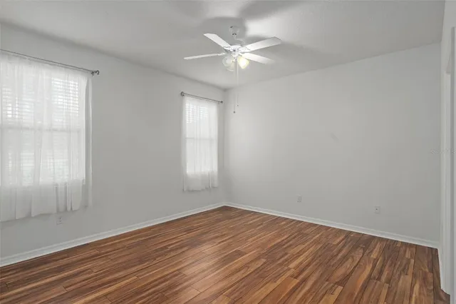 a bathroom with double sink and a mirror