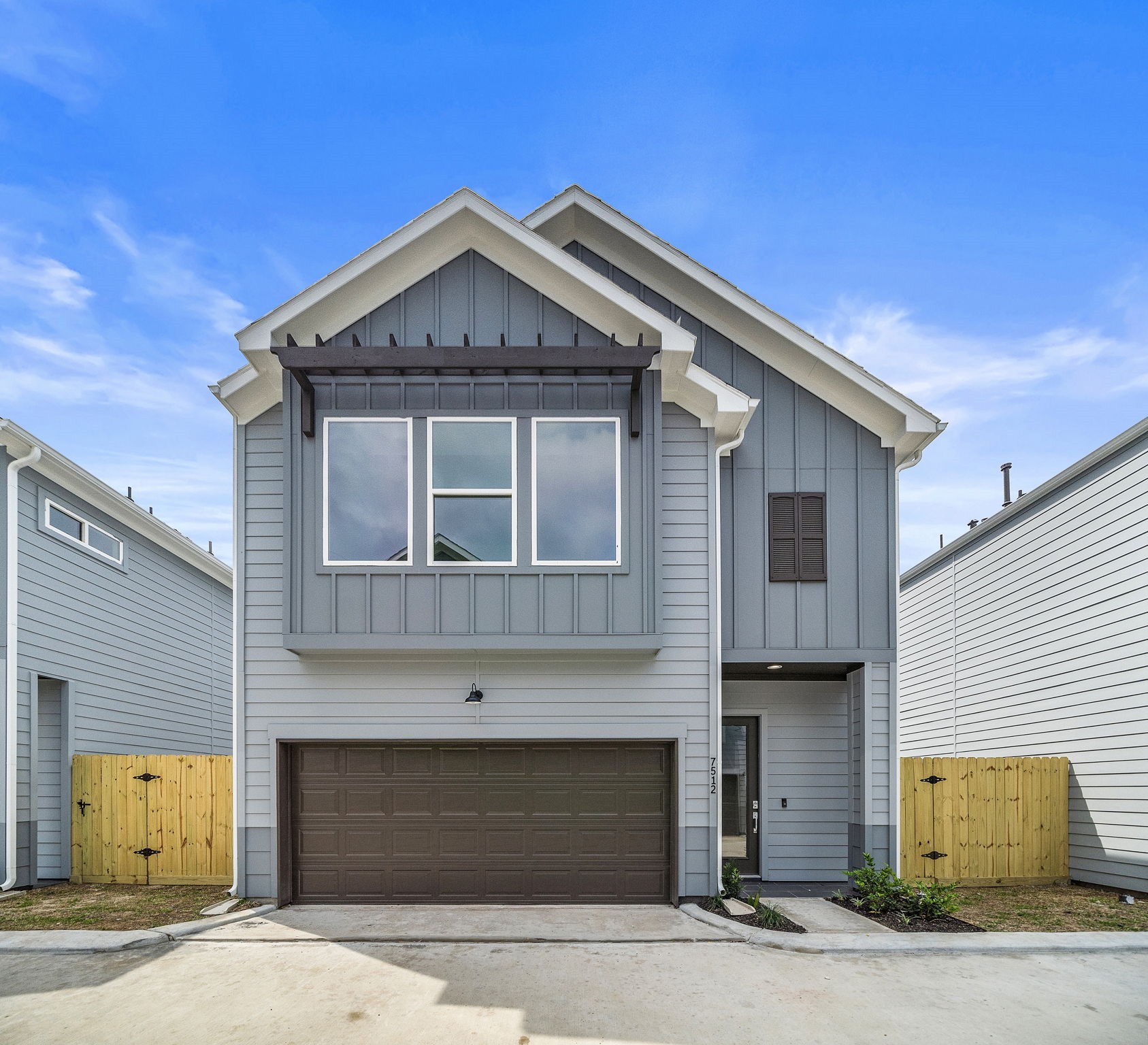 a front view of a house with a garage