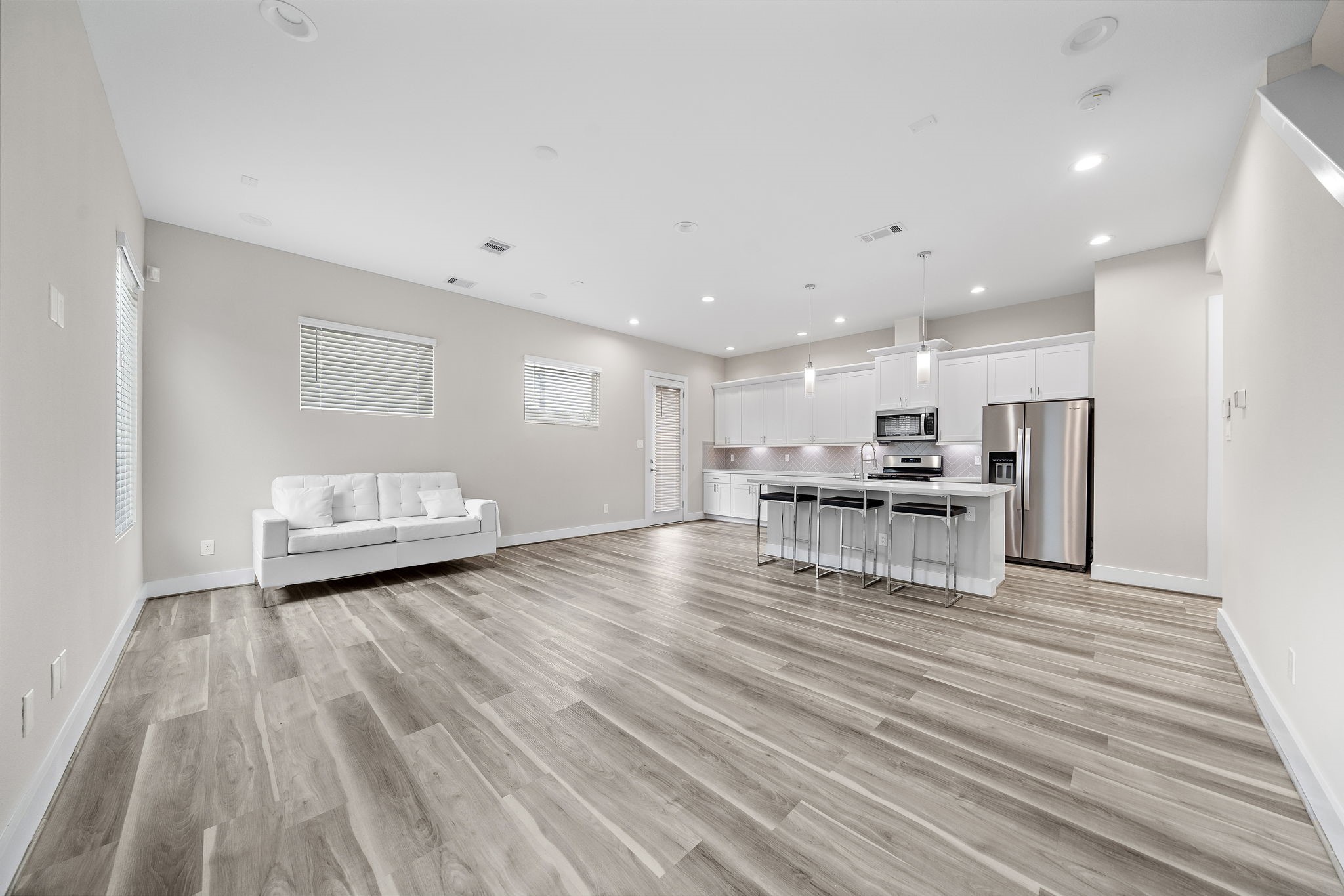 7510 Sandle Street Houston, TX 77088 - Photo 4 of 26 a view of kitchen with furniture and wooden floor