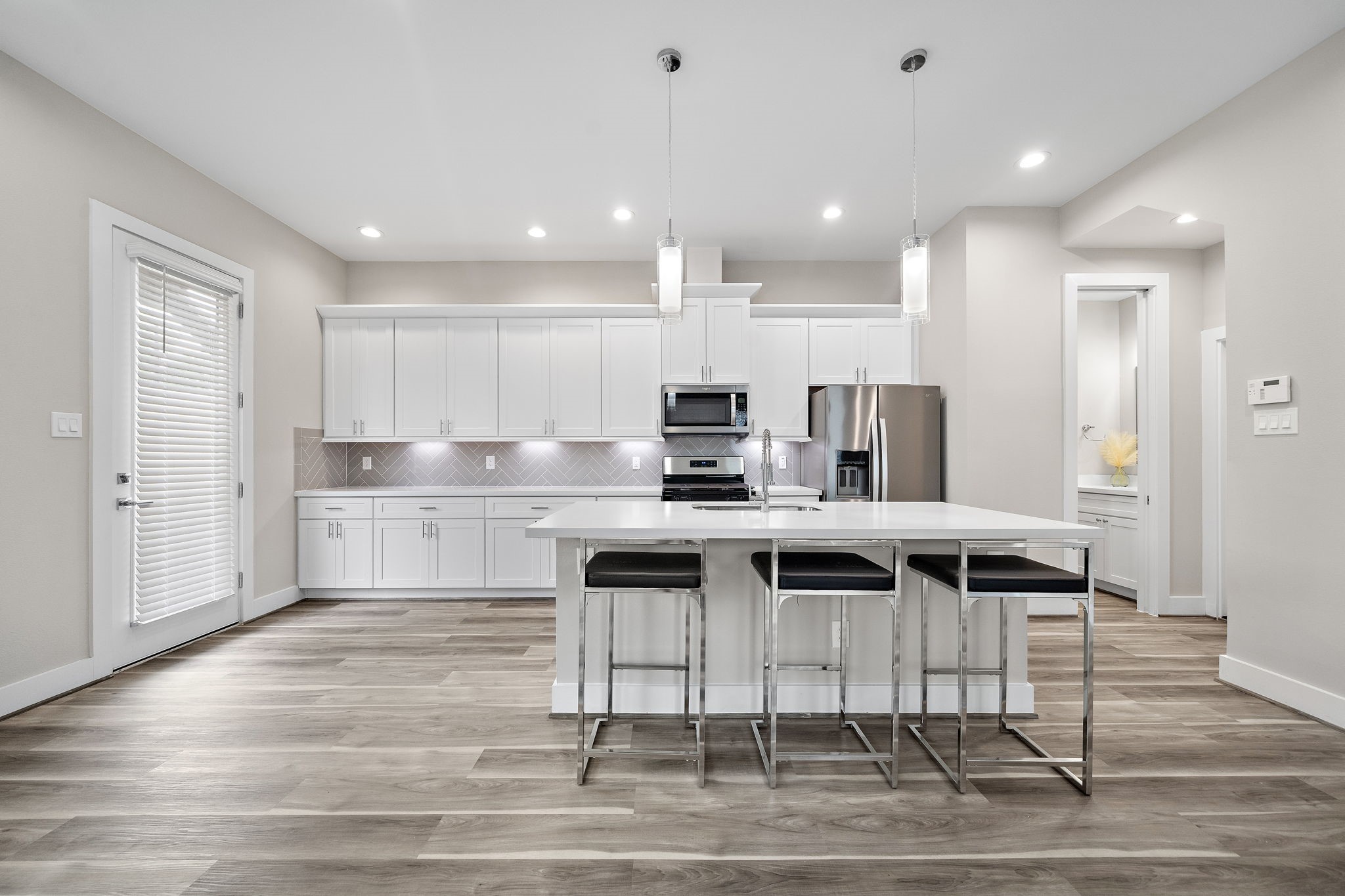 7510 Sandle Street Houston, TX 77088 - Photo 5 of 26 a kitchen with kitchen island stainless steel appliances a sink and cabinets