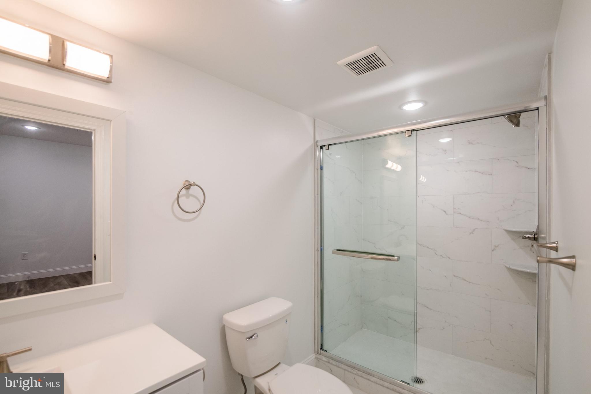 129 Washington Avenue, Unit B Philadelphia, PA 19147 - Photo 12 of 18 a bathroom with a shower a toilet and a sink