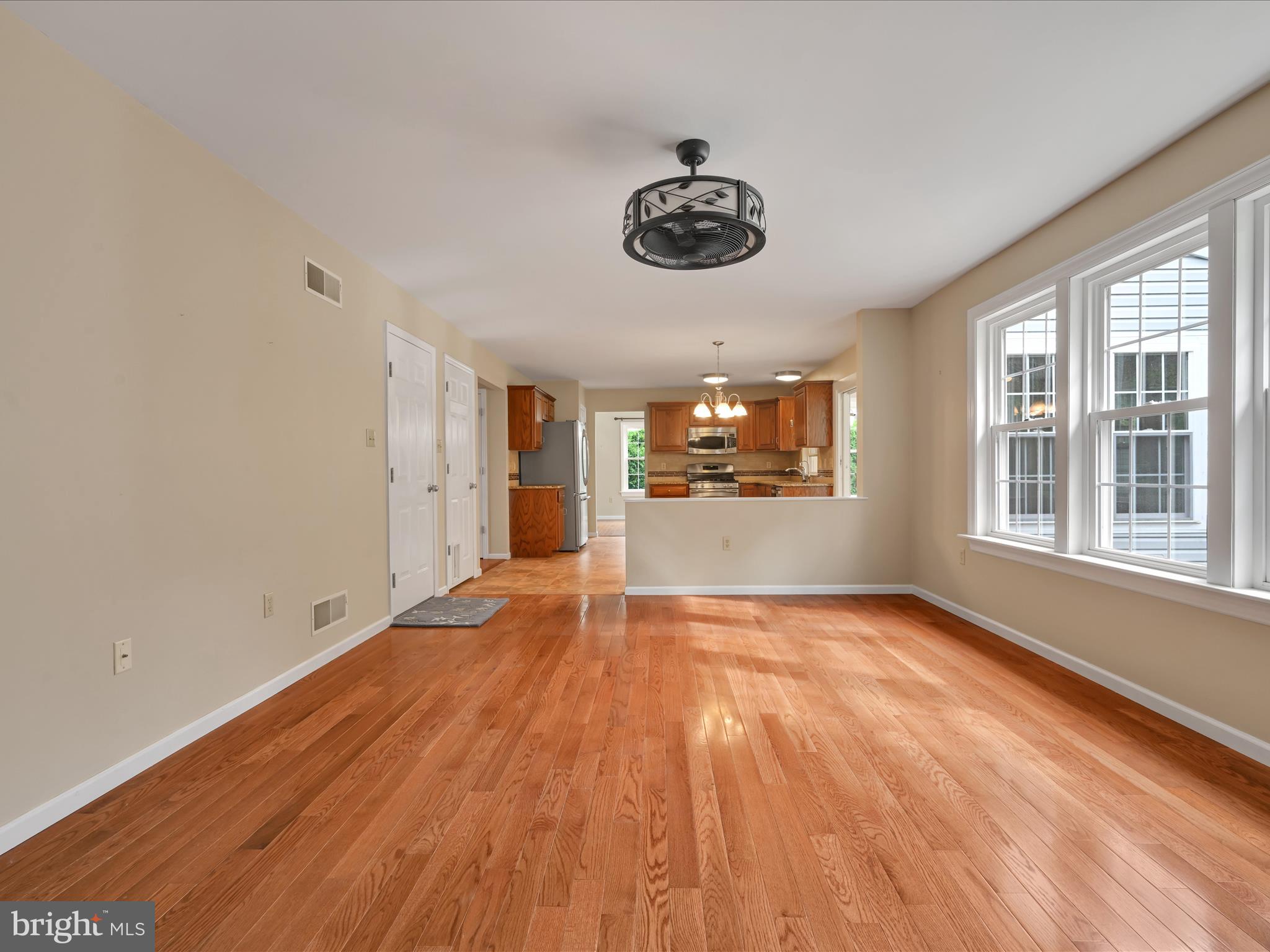 2602 Andrew Drive Sinking Spring, PA 19608 - Photo 18 of 47 a view of an empty room with a window and wooden floor