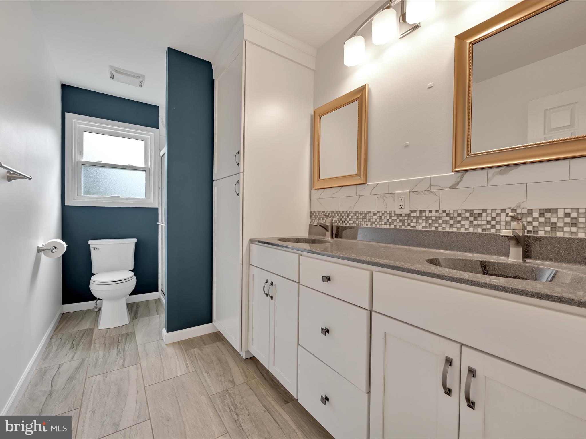2602 Andrew Drive Sinking Spring, PA 19608 - Photo 29 of 47 a spacious bathroom with a sink and a mirror