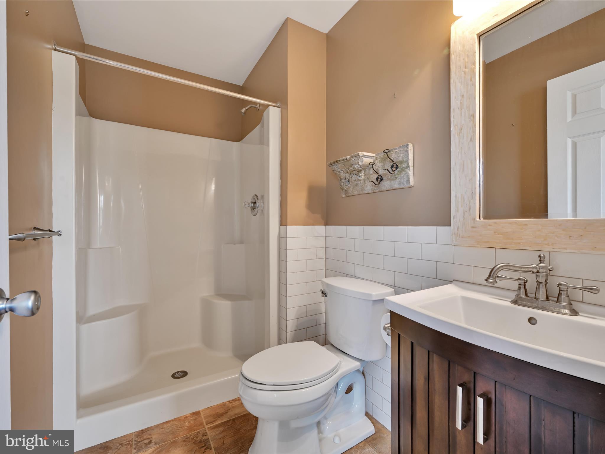 2602 Andrew Drive Sinking Spring, PA 19608 - Photo 33 of 47 a bathroom with a sink and a mirror