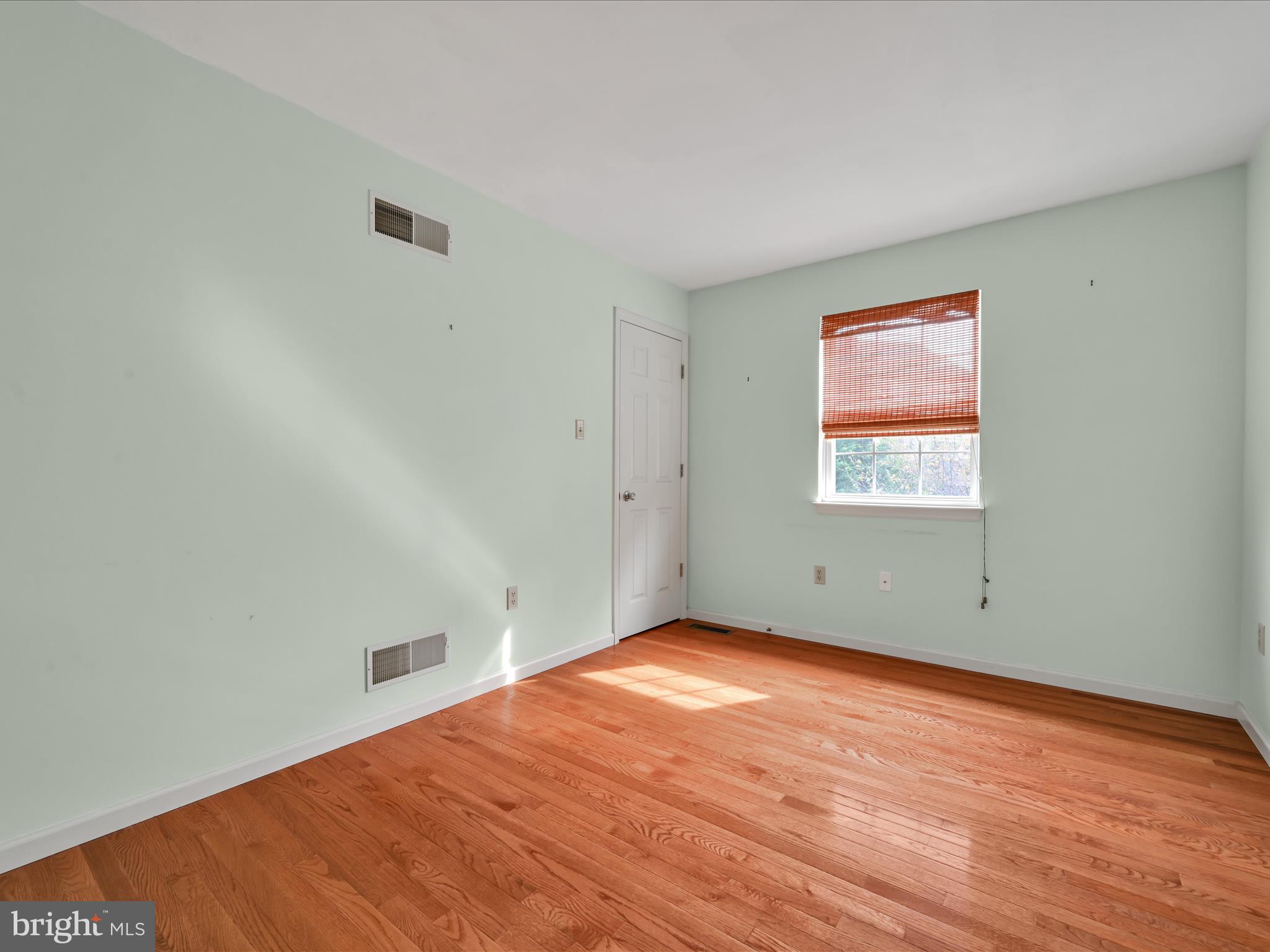 2602 Andrew Drive Sinking Spring, PA 19608 - Photo 34 of 47 an empty room with wooden floor and windows