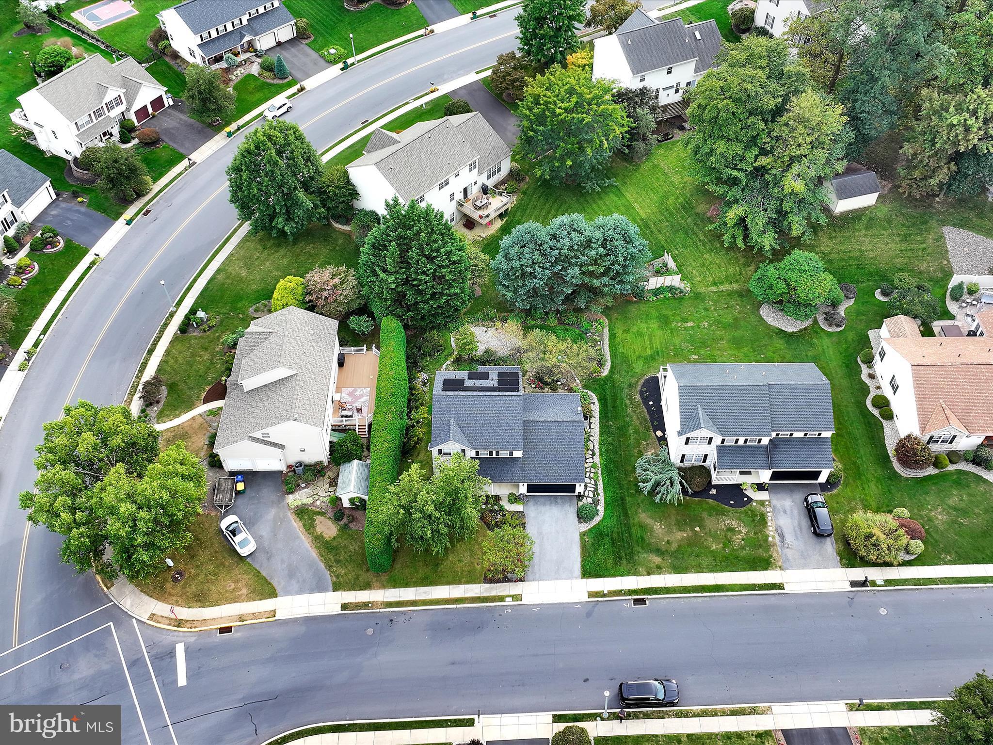 2602 Andrew Drive Sinking Spring, PA 19608 - Photo 5 of 47 an aerial view of multiple houses with yard