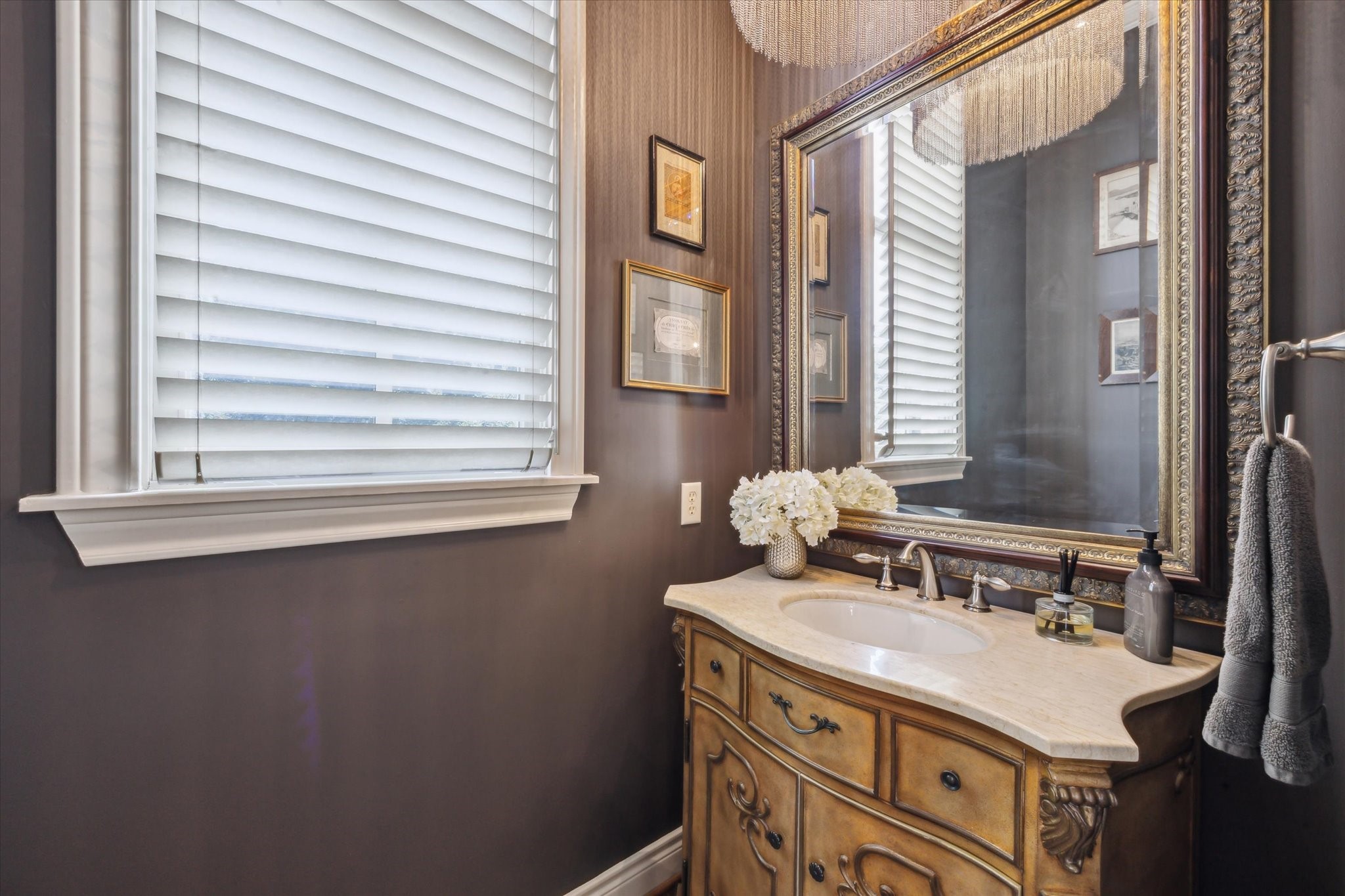 2405 Richton Street Houston, TX 77098 - Photo 12 of 24 a bathroom with a sink vanity and a mirror