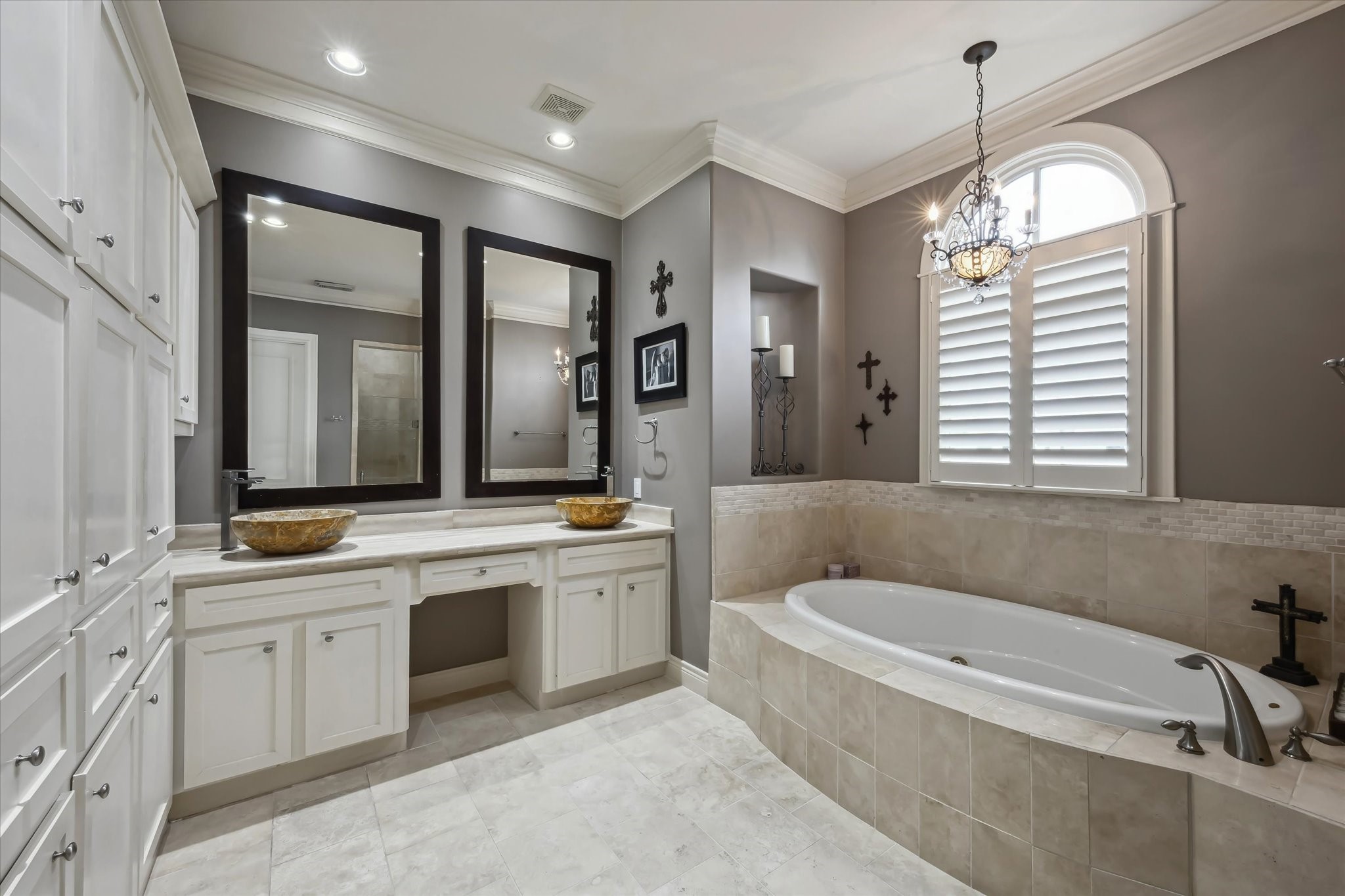 2405 Richton Street Houston, TX 77098 - Photo 16 of 24 a bathroom with a granite countertop tub a sink and a window