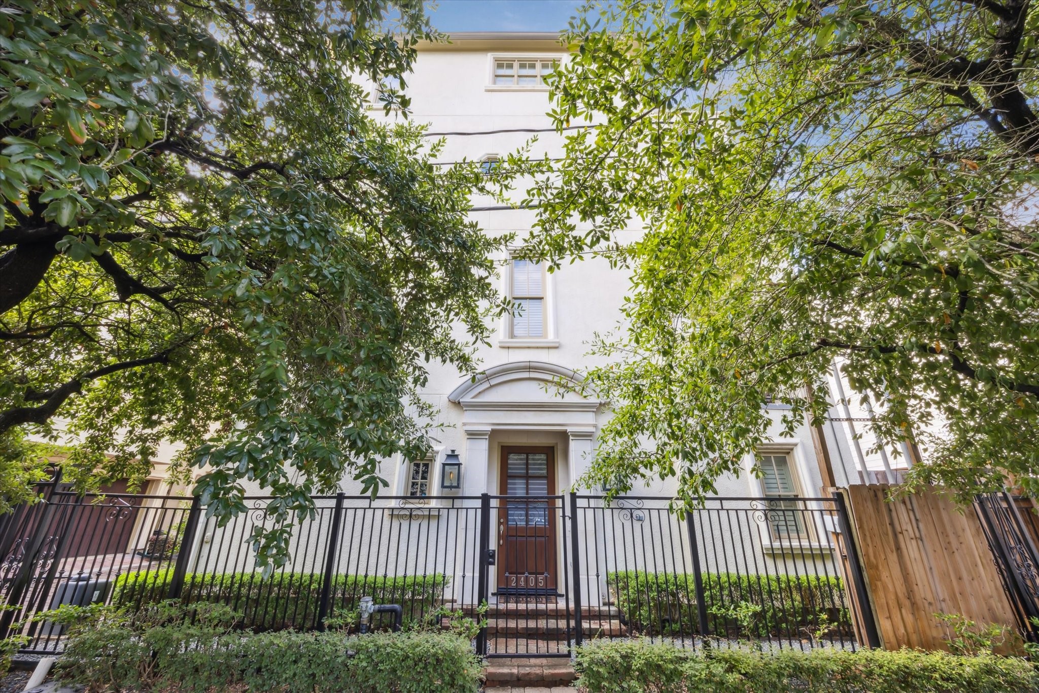2405 Richton Street Houston, TX 77098 - Photo 2 of 24 a front view of a house with a garden