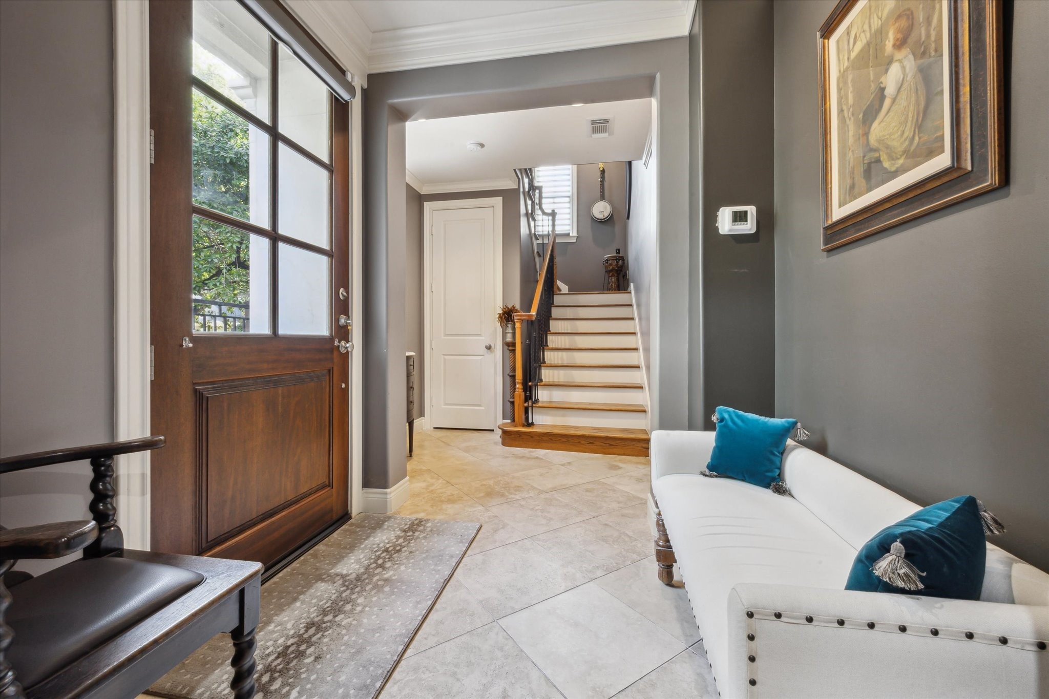2405 Richton Street Houston, TX 77098 - Photo 3 of 24 a view of a bedroom with furniture and windows