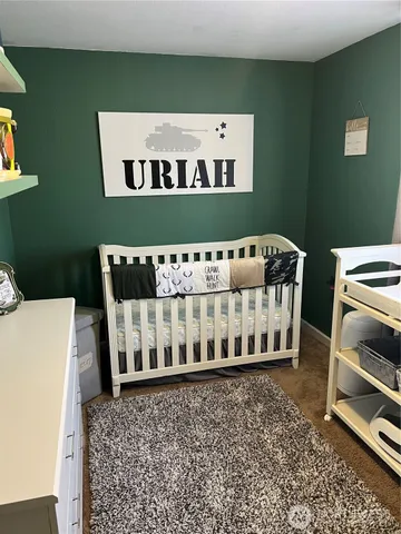 a view of a room with furniture and window