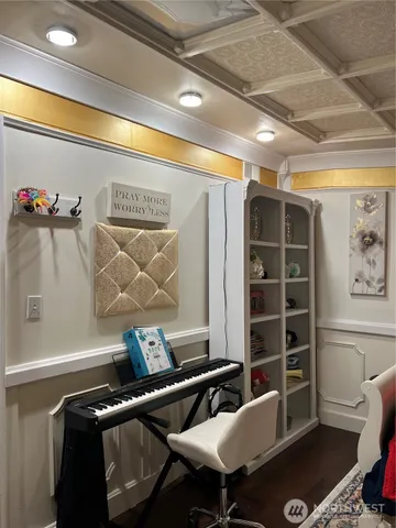 a bathroom with a sink mirror and vanity