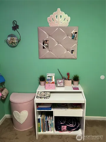 a table with a fireplace and a wooden floor
