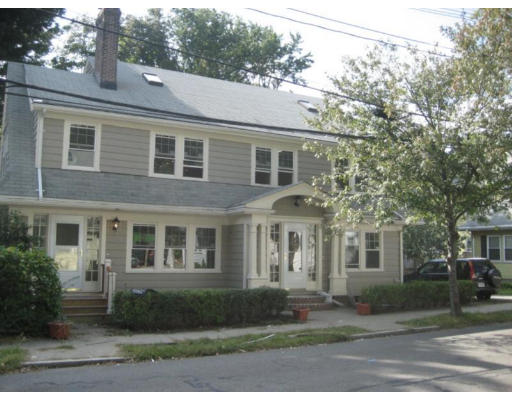 54 Beaconsfield Road, Unit 1 Brookline, MA 02445 - Photo 3 of 7 a front view of a house with a yard