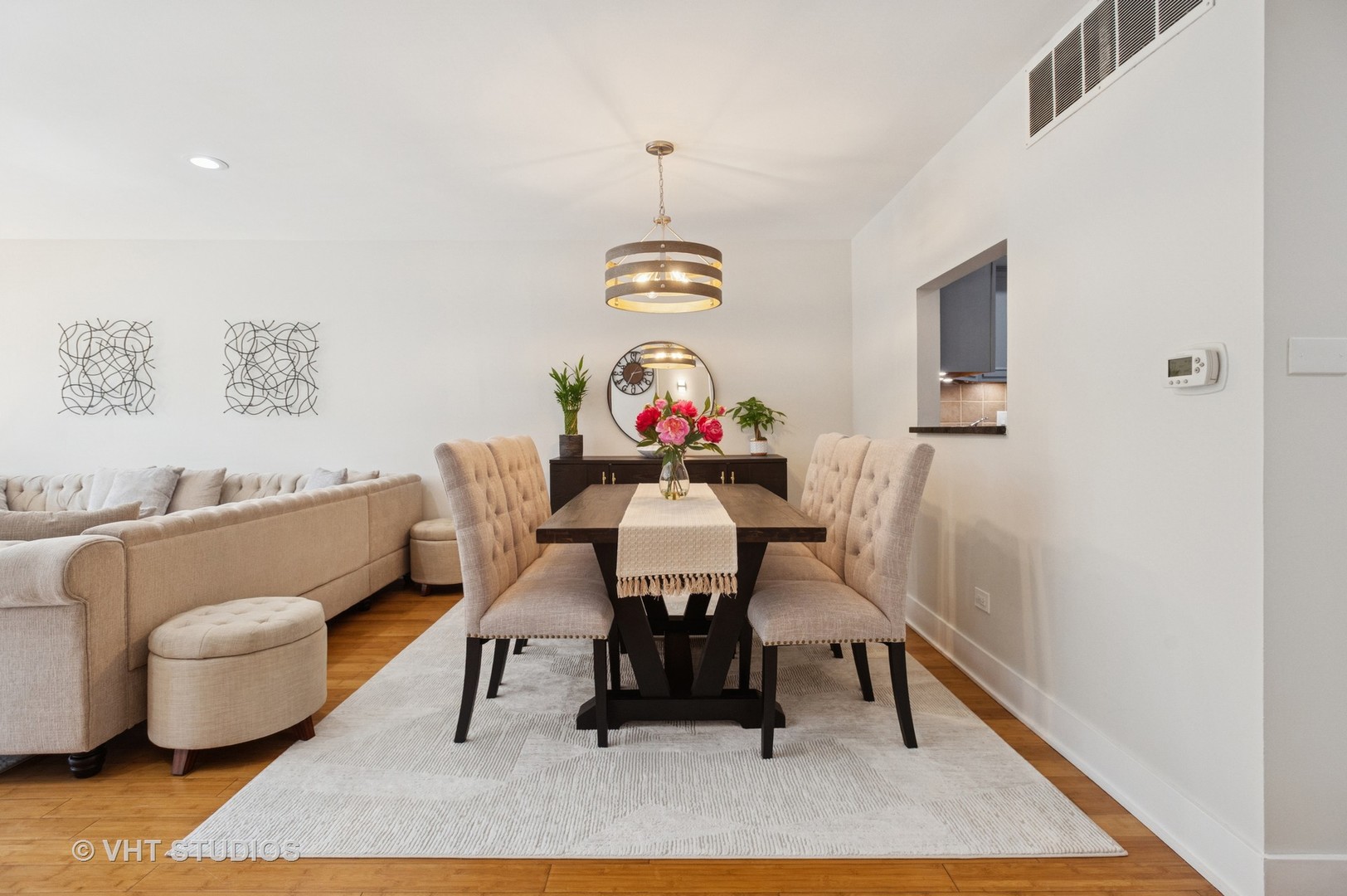 7200 North Ridge Boulevard, Unit 2C Chicago, IL 60645 - Photo 9 of 20 a view of a dining room with furniture and wooden floor