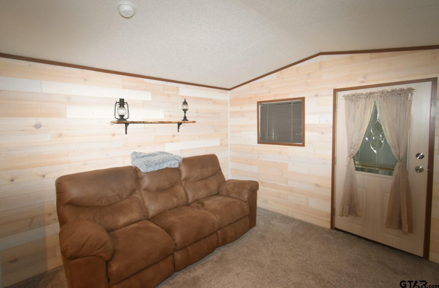 6435 FM 17, Unit 337 Yantis, TX 75497 - Photo 13 of 31 a living room with furniture